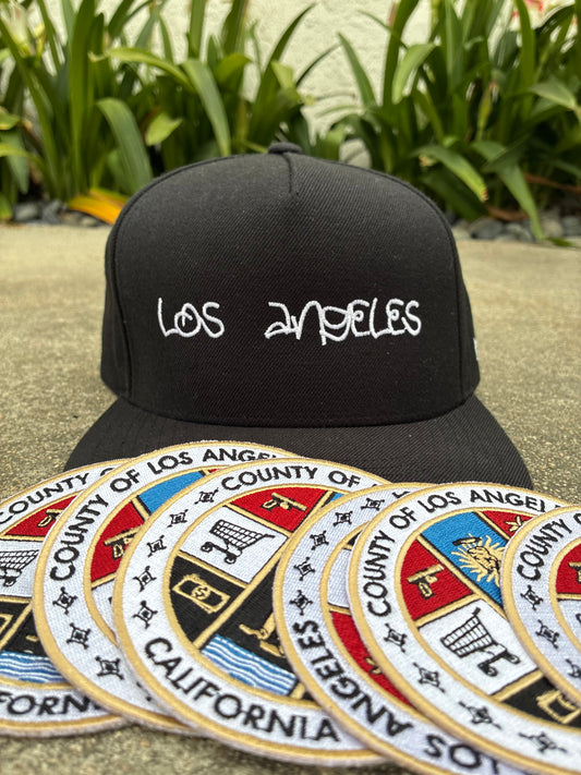 LA REP- SnapBack + BASKETS County Seal